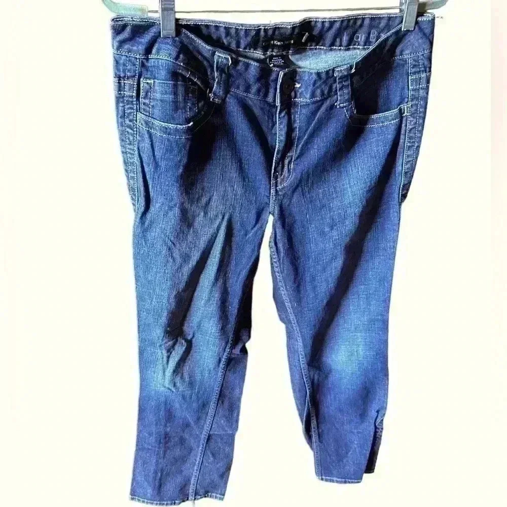 Calvin Klein Size 14 Lean Bootcut jeans.Dark wash.Back flap button pockets.